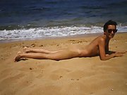 My wife Tatiana at the beach showing her hairy pussy