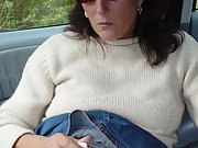 Horny brunette amateur masturbates her hairy pussy in her car