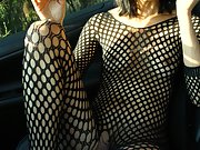 Fishnet bodysuit, sexy striptease, car in the woods, alluring poses
