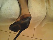 Amateur wife wearing black stockings on sofa