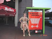 Blonde MILF gives a peepshow several public places