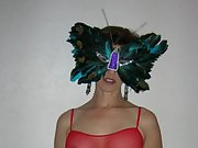 Beautiful brunette in tit bearing sheer lingerie and sexy feather mask