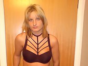 Seductive lingerie showcases the body of a sexy blonde female