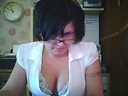 Brunette wife working in the office flashes her tits