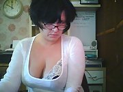 Brunette wife working in the office flashes her tits