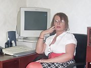 Secretary gets horny at work and fingers her moist pussy