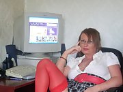 Secretary gets horny at work and fingers her moist pussy