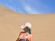Natalie shows tits and spreads her juicy pussy in the dunes