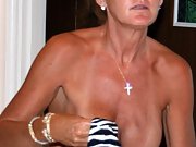 Blonde milf shows her hard nipples and wet hairy pussy