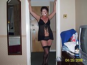 Mature woman in black lingerie shows off her luscious curves