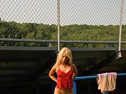 This sexy blonde milf loves red lingerie and getting naked
