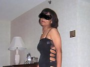 Mature brunette shows off her sexy body in black lingerie