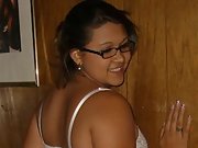 Blonde wife wearing glasses poses in white lingerie