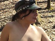 Brunette goes topless for a fun hike in the woods
