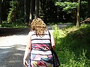 German web slut walks through the woods