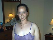 Brunette wife wearing purple lingerie shows off her big tits