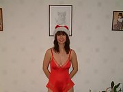 Sexy brunette wife wearing santa outfit exposes her ass