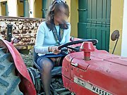 Brunette wife shows off her hairy pussy while driving a tractor