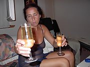 Chick drinks wine and wears transparent lingerie showing her tits
