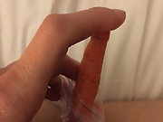 Desperate housewife fucks a carrot and creams on it
