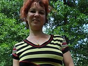 Sexy MILF  bbw red head poses nude in the forest
