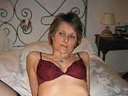 Still photos of my naked wife on the bed with her legs open