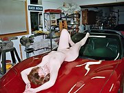 Nancy shows off her hairy pussy on top of corvette