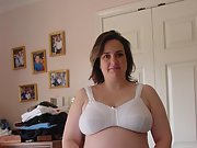 Brunette milf takes off her bra and shows her big tits