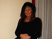 Sexy milf with brunette hair shows off her perky tits