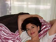 Brunette milf shows off her big lickable tits and sexy lingerie
