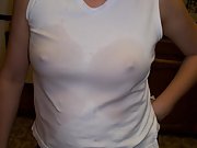 Wet tee shirt shows pretty perky tits with hard nipples