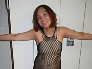 My wife Diana in posing in fishnet for your pleasure