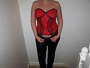 Sexy wife wearing black leather pants and red body paint