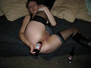 Sexy hot wife takes beer bottle in her ass and shows off pussy