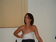 This skinny brunette wife poses in a tiny ass skirt