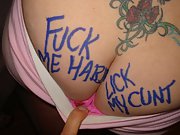 Tattooed redhead displays the naughty graffiti on her sexy body