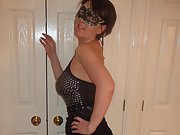 Masked woman in black lingerie shows off pretty bare pussy