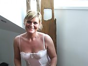 Smiley mature blonde slut shows her bushy cunt in lingerie