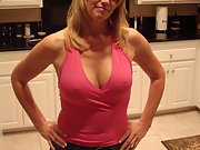 Sexy blonde woman shows off her big tits and pussy