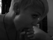 Short haired blonde girl enjoys in giving head in point of view