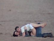Young lovers caught hidden by camera making out at beach